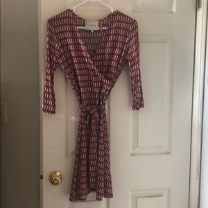 Leota faux wrap dress. Pink and Orange.